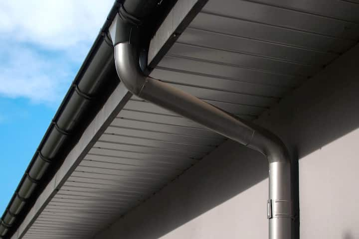 Corrosion-resistant galvanized gutters installed on a commercial building in Shreveport